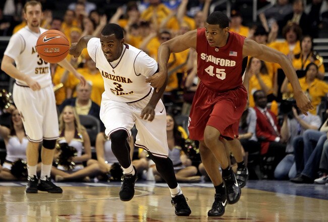LOS ANGELES, CA - MARCH 11:  Ty Abbott #3 of the Arizona State Sun Devils and Jeremy Green #45 of the Stanford Cardinal fight for a loose ball in the first half during the Quarterfinals of the Pac-10 Basketball Tournament at Staples Center on March 11, 2010 in Los Angeles, California.  (Photo by Jeff Gross/Getty Images)