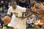 KANSAS CITY,MO - NOVEMBER 24:  Ashton Gibbs #12 of the Pittsburgh Panthers drives the ball against the Texas Longhorns during the CBE Classic championship game on November 24, 2009 at Sprint Center in Kansas City, Missouri. (Photo by: Jamie Squire/Getty Images)