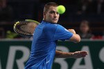 PARIS - NOVEMBER 09: Mikhail Youzhny of Russia in action during his second round match against Ernests Gulbis of Latvia during Day Three of the ATP Masters Series Paris at the Palais Omnisports on November 9, 2010 in Paris, France.  (Photo by Michael Steele/Getty Images)