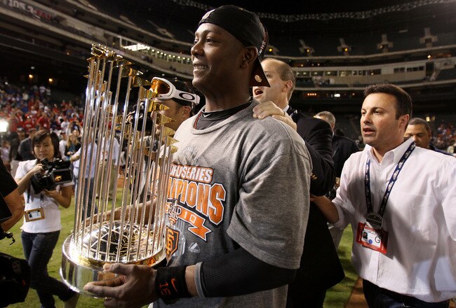 ARLINGTON, TX - NOVEMBER 01:  World Series MVP Edgar Renteria #16 of the San Francisco Giants celebrates on the field with the World Series Championship trophy after the Giants won 3-1 against the Texas Rangers in Game Five of the 2010 MLB World Series at Rangers Ballpark in Arlington on November 1, 2010 in Arlington, Texas.  (Photo by Elsa/Getty Images)