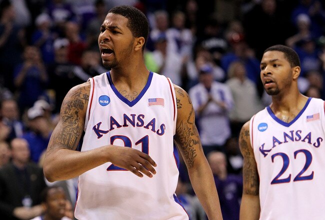 OKLAHOMA CITY - MARCH 20:  (L-R) Markieff Morris #21 and Marcus Morris #22 of the Kansas Jayhawks react against the Northern Iowa Panthers during the second round of the 2010 NCAA men's basketball tournament at Ford Center on March 20, 2010 in Oklahoma City, Oklahoma.  (Photo by Ronald Martinez/Getty Images)