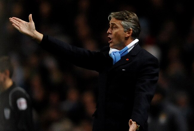 MANCHESTER, UNITED KINGDOM - NOVEMBER 10:   Manchester City Manager Roberto Mancini reacts during the Barclays Premier League match between Manchester City and Manchester United at the City of Manchester Stadium on November 10, 2010 in Manchester, England. (Photo by Laurence Griffiths/Getty Images)