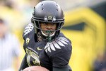 EUGENE, OR - NOVEMBER 06: Cornerback Cliff Harris #13 of the Oregon Ducks runs back a punt in the fourth quarter of the game against the Washington Huskies at Autzen Stadium on November 6, 2010 in Eugene, Oregon. The Ducks won the game 53-16. (Photo by Steve Dykes/Getty Images)