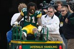 GREEN BAY, WI - NOVEMBER 22: Defensive back Al Harris #31 of the Green Bay Packers is taken off the field on a cart after an injury against the San Francisco 49ers at Lambeau Field on November 22, 2009 in Green Bay, Wisconsin. The Packers defeated the 49ers 30-24. (Photo by Scott Boehm/Getty Images)