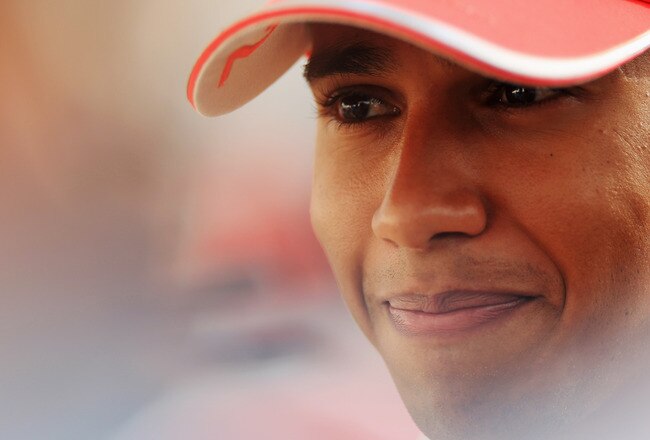 ABU DHABI, UNITED ARAB EMIRATES - NOVEMBER 11:  Lewis Hamilton of Great Britain and McLaren Mercedes is interviewed by the media during previews to the Abu Dhabi Formula One Grand Prix at the Yas Marina Circuit on November 11, 2010 in Abu Dhabi, United Arab Emirates.  (Photo by Mark Thompson/Getty Images)