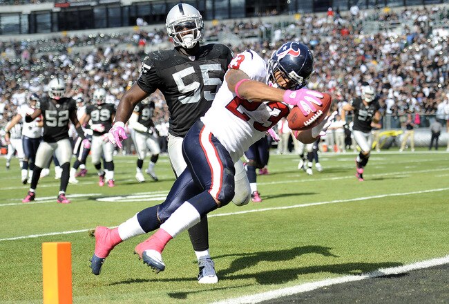 OAKLAND, CA - OCTOBER 3:  Running back Arian Foster #23 of the Houston Texans scores a touchdown in front of linebacker Rolando McClain #55 of the Oakland Raiders  during an NFL football game October 3, 2010 at The Oakland-Alameda County Coliseum in Oakland, California. The Texans won the game 31-24.  (Photo by Thearon W. Henderson/Getty Images)