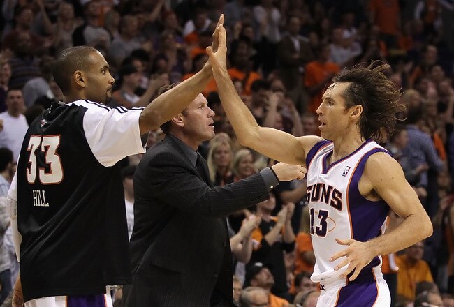 PHOENIX - NOVEMBER 05:  Steve Nash #13 of the Phoenix Suns high fives teammate Grant Hill #33 during the NBA game against the Memphis Grizzlies at US Airways Center on November 5, 2010 in Phoenix, Arizona.  The Suns defeated the Grizzlies 123-118 in double overtime.  NOTE TO USER: User expressly acknowledges and agrees that, by downloading and or using this photograph, User is consenting to the terms and conditions of the Getty Images License Agreement.  (Photo by Christian Petersen/Getty Images)