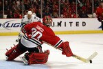 CHICAGO - OCTOBER 20: Marty Turco #30 of the Chicago Blackhawks makes a save in the 3rd period against the Vancouver Canucks at the United Center on October 20, 2010 in Chicago, Illinois. The Blackhawks defeated the Canucks 2-1 in a shootout. (Photo by Jonathan Daniel/Getty Images)