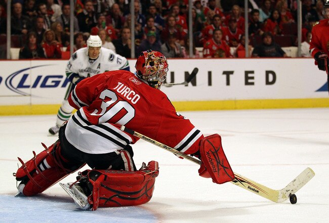 CHICAGO - OCTOBER 20: Marty Turco #30 of the Chicago Blackhawks makes a save in the 3rd period against the Vancouver Canucks at the United Center on October 20, 2010 in Chicago, Illinois. The Blackhawks defeated the Canucks 2-1 in a shootout. (Photo by Jonathan Daniel/Getty Images)