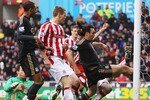 STOKE ON TRENT, ENGLAND - JANUARY 16:  Sotirios Kyrgiakos of Liverpool scores a goal during the Barclays Premier League match between Stoke City and Liverpool at the Britannia Stadium on January 16, 2010 in Stoke on Trent, England.  (Photo by Mark Thompson/Getty Images)