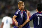 OSAKA, JAPAN - SEPTEMBER 07: Keisuke Honda of Japan celebrates during the international friendly match between Japan and Guatemala at Nagai Stadium on September 7, 2010 in Osaka, Japan. (Photo by Koji Watanabe/Getty Images)
