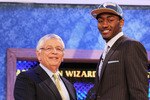 NEW YORK - JUNE 24:  John Wall of Kentucky stands with NBA Commisioner David Stern after being drafted with the first pick by The Washington Wizards at Madison Square Garden on June 24, 2010 in New York, New York City. NOTE TO USER: User expressly acknowledges and agrees that, by downloading and or using this photograph, User is consenting to the terms and conditions of the Getty Images License Agreement. (Photo by Al Bello/Getty Images)