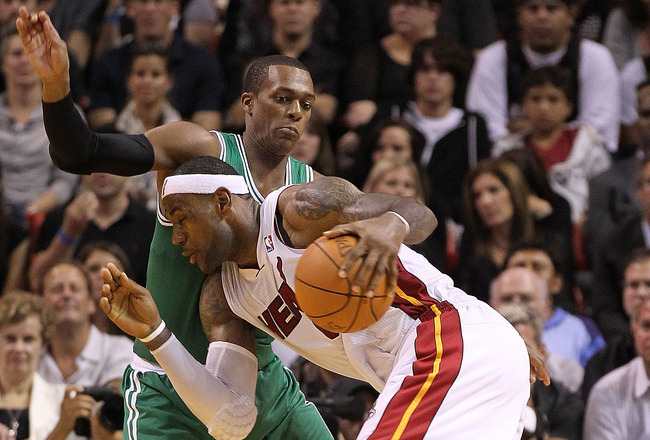 MIAMI - NOVEMBER 11:  LeBron James #6 of the Miami Heat drives against Rajon Rondo #9 during a game against the Boston Celtics at American Airlines Arena on November 11, 2010 in Miami, Florida. NOTE TO USER: User expressly acknowledges and agrees that, by downloading and/or using this Photograph, User is consenting to the terms and conditions of the Getty Images License Agreement.  (Photo by Mike Ehrmann/Getty Images)