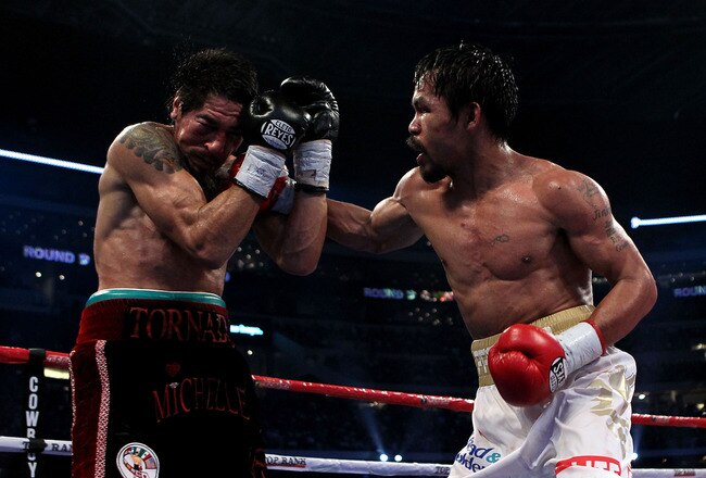 ARLINGTON, TX - NOVEMBER 13:  Manny Pacquiao (white trunks) of the Philippines lands a punch against Antonio Margarito (black trunks) of Mexico during their WBC World Super Welterweight Title bout at Cowboys Stadium on November 13, 2010 in Arlington, Texas.  (Photo by Nick Laham/Getty Images)