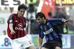 MILAN, ITALY - APRIL 14: Kaka of AC Milan challenges Luis Figo of Inter during the Serie A match between AC Milan and Inter Milan at the San Siro on April 14, 2006 in Milan, Italy. AC won the match 1-0. (Photo by Newpress/Getty Images)