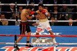 ARLINGTON, TX - NOVEMBER 13:  Manny Pacquiao (white trunks) of the Philippines fights against Antonio Margarito (black trunks) of Mexico during their WBC World Super Welterweight Title bout at Cowboys Stadium on November 13, 2010 in Arlington, Texas.  (Photo by Tom Pennington/Getty Images)