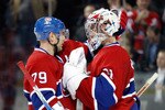 MONTREAL - NOVEMBER 9:  Carey Price #31 of the Montreal Canadiens celebrates his shutout victory over the Vancouver Canucks with teammate Andrei Markov #79 during the NHL game at the Bell Centre on November 9, 2010 in Montreal, Quebec, Canada.  The Canadiens defeated the Canucks 2-0.  (Photo by Richard Wolowicz/Getty Images)