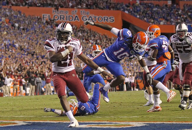 GAINESVILLE, FL - NOVEMBER 13:  Marcus Lattimore #21 of the South Carolina Gamecocks rushes for a touchdown during a game against the Florida Gators at Ben Hill Griffin Stadium on November 13, 2010 in Gainesville, Florida.  (Photo by Mike Ehrmann/Getty Images)