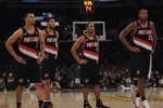 LOS ANGELES, CA - NOVEMBER 07:  Brandon Roy #7, Nicolas Batum #88, Andre Miller #24 and Marcus Camby #23 of the Portland Trail Blazers watch a Los Angeles Lakers freethrow during the first half at the Staples Center on November 7, 2010 in Los Angeles, California.  NOTE TO USER: User expressly acknowledges and agrees that, by downloading and/or using this photograph, User is consenting to the terms and conditions of the Getty Images License Agreement.  (Photo by Harry How/Getty Images)