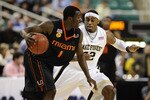 GREENSBORO, NC - MARCH 11:  L.D. Williams #42 of the Wake Forest Demon Deacons guards Durand Scott #1 of the University of Miami Hurricanes in their first round game in the 2010 ACC Men's Basketball Tournament at the Greensboro Coliseum on March 11, 2010 in Greensboro, North Carolina.  (Photo by Jeff Zelevansky/Getty Images)