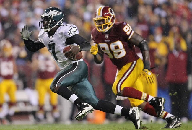 LANDOVER, MD - NOVEMBER 15:  Michael Vick #7 of the Philadelphia Eagles makes a break past Brian Orakpo #98 of the Washington Redskins on November 15, 2010 at FedExField in Landover, Maryland.  (Photo by Chris McGrath/Getty Images)