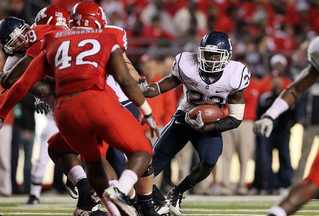 PISCATAWAY, NJ - OCTOBER 08:  Jordan Todman #23 of the Connecticut Huskies runs the ball against the Rutgers Scarlet Knights at Rutgers Stadium on October 8, 2010 in Piscataway, New Jersey. Rutgers defeated UConn 27-24.  (Photo by Jim McIsaac/Getty Images)