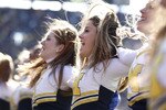 ANN ARBOR, MI - NOVEMBER 06: Members of the Michigan Wolverines dance team perform while playing the Illinios Fighting Illini at Michigan Stadium on November 6, 2010 in Ann Arbor, Michigan. Michigan won the game 67-65.  (Photo by Gregory Shamus/Getty Images)