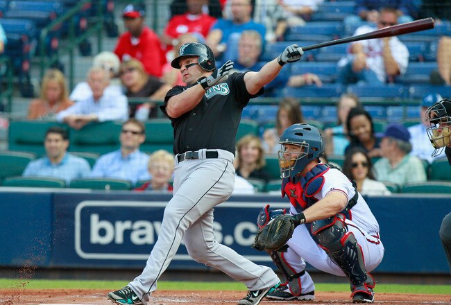 ATLANTA - SEPTEMBER 29:  Dan Uggla #6 of the Florida Marlins against David Ross #8 of the Atlanta Braves at Turner Field on September 29, 2010 in Atlanta, Georgia.  (Photo by Kevin C. Cox/Getty Images)