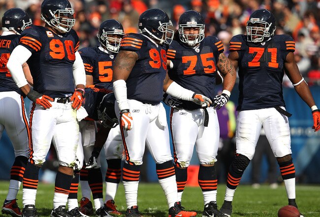 CHICAGO - NOVEMBER 14: Members of the Chicago Bear defense including (L-R) Julius Peppers #90, Lance Briggs #55, Marcus Harrison #99, Matt Toeaina #75 and Israel Idonije #71 await the start of play against the Minnesota Vikings at Soldier Field on November 14, 2010 in Chicago, Illinois. The Bears defeated the Vikings 27-13. (Photo by Jonathan Daniel/Getty Images)