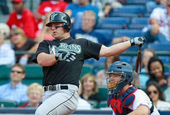 ATLANTA - SEPTEMBER 29:  Dan Uggla #6 of the Florida Marlins against David Ross #8 of the Atlanta Braves at Turner Field on September 29, 2010 in Atlanta, Georgia.  (Photo by Kevin C. Cox/Getty Images)