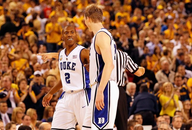 INDIANAPOLIS - APRIL 03:  Nolan Smith #2 of the Duke Blue Devils reacts with teammate Kyle Singler #12 before the Blue Devils defeated the West Virginia Mountaineers 78-57 during the National Semifinal game of the 2010 NCAA Division I Men's Basketball Championship at Lucas Oil Stadium on April 3, 2010 in Indianapolis, Indiana.  (Photo by Kevin C. Cox/Getty Images)