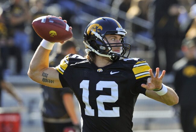 IOWA CITY, IA - OCTOBER 30- Quarterback Ricky Stanzi #12 of the University of Iowa Hawkeyes warms up his throwing arm before play against the Michigan State Spartans at Kinnick Stadium on October 30, 2010 in Iowa City, Iowa. Iowa won 37-6 over Michigan State. (Photo by David Purdy/Getty Images)