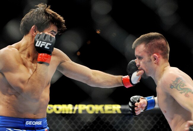 LAS VEGAS - NOVEMBER 21: George Sotiropoulos (L) battles Jason Dent (R) during their Lightweight Fight at the UFC 106 at Mandalay Bay Events Center on November 21, 2009 in Las Vegas, Nevada. (Photo by Jon Kopaloff/Getty Images)