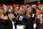 AUBURN, AL - NOVEMBER 13:  Quarterback Cameron Newton #2 of the Auburn Tigers celebrates with fans after their 49-31 win over the Georgia Bulldogs at Jordan-Hare Stadium on November 13, 2010 in Auburn, Alabama.  (Photo by Kevin C. Cox/Getty Images)