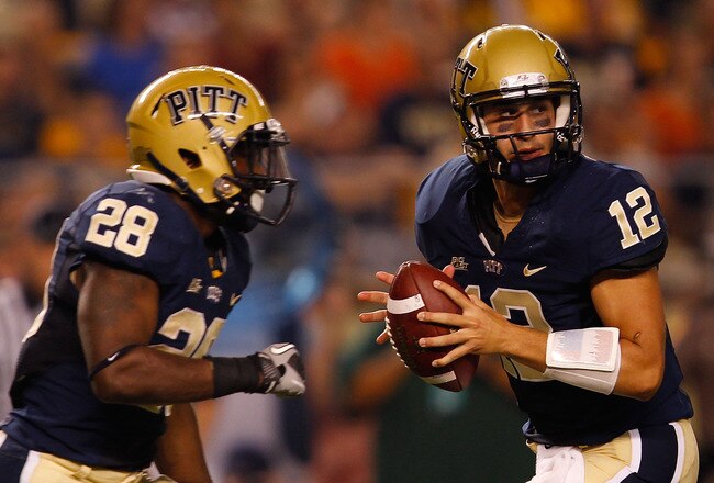 PITTSBURGH - SEPTEMBER 23:  Tino Sunseri #12 of the Pittsburgh Panthers drops back to pass in front of teammate Dion Lewis #28 during the game against the Miami Hurricanes on September 23, 2010 at Heinz Field in Pittsburgh, Pennsylvania.  (Photo by Jared Wickerham/Getty Images)