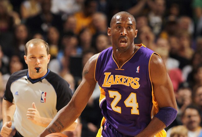 DENVER - NOVEMBER 11:  Kobe Bryant #24 of the Los Angeles Lakers dribbles the ball upcourt against the Denver Nuggets at the Pepsi Center on November 11, 2010 in Denver, Colorado. The Nuggets defeated the Lakers 118-112.  NOTE TO USER: User expressly acknowledges and agrees that, by downloading and/or using this Photograph, User is consenting to the terms and conditions of the Getty Images License Agreement.  (Photo by Doug Pensinger/Getty Images)