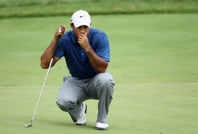KOHLER, WI - AUGUST 14:  Tiger Woods lines up a putt on the third green during the third round of the 92nd PGA Championship on the Straits Course at Whistling Straits on August 14, 2010 in Kohler, Wisconsin.  (Photo by Andy Lyons/Getty Images)