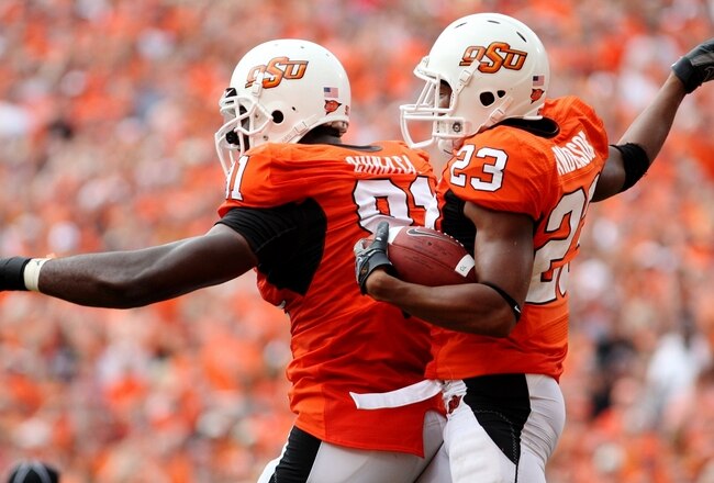 STILLWATER, OK - SEPTEMBER 5:  Ugo Chinasa #91 and Terrance Anderson #23 of the Oklahoma State Cowboys defense celebrate recovering a fumble  in the second quarter of the game against the Georgia Bulldogs at Boone Pickens Stadium on September 5, 2009 in Stillwater, Oklahoma. (Photo by Christian Petersen/Getty Images)