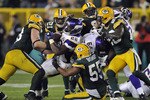 GREEN BAY, WI - OCTOBER 24:  Adrian Peterson #28 of the Minnesota Vikings is stopped by Desmond Bishop #55 of the Green Bay Packers at Lambeau Field on October 24, 2010 in Green Bay, Wisconsin. (Photo by Jim Prisching/Getty Images)