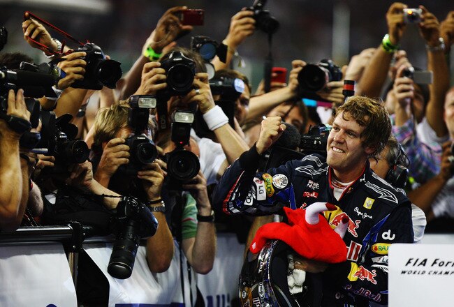 ABU DHABI, UNITED ARAB EMIRATES - NOVEMBER 14:  Race winner and F1 2010 World Champion Sebastian Vettel of Germany and Red Bull Racing celebrates in parc ferme following the Abu Dhabi Formula One Grand Prix at the Yas Marina Circuit on November 14, 2010 in Abu Dhabi, United Arab Emirates.  (Photo by Ker Robertson/Getty Images)