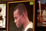 PITTSBURGH - JULY 7: Fans look over Roberto Clemente memorabilia during opening day of Fan Fest for the Major League Baseball 2006 All-Star game at the David L. Lawrence Convention Center July 7, 2006 in Pittsburgh, Pennsylvania. (Photo by Paul Hawthorne/Getty Images)