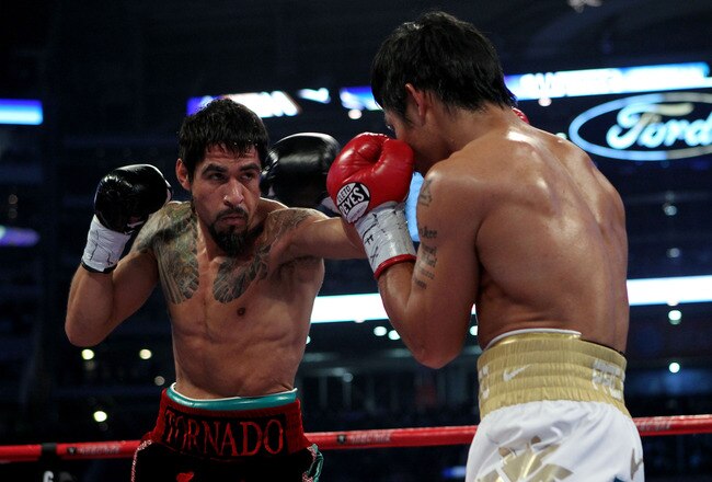 ARLINGTON, TX - NOVEMBER 13:  Antonio Margarito (black trunks) of Mexico throws a punch against Manny Pacquiao (white trunks) of the Philippines during their WBC World Super Welterweight Title bout at Cowboys Stadium on November 13, 2010 in Arlington, Texas.  (Photo by Nick Laham/Getty Images)