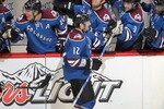 DENVER - NOVEMBER 15:  Kevin Porter #12 of the Colorado Avalanche is congratulated by his teammates for his third period goal of the St. Louis Blues along with Kevin Shattenkirk #8 at the Pepsi Center on November 15, 2010 in Denver, Colorado. The Avalanche defeated the Blues 6-3.  (Photo by Doug Pensinger/Getty Images)