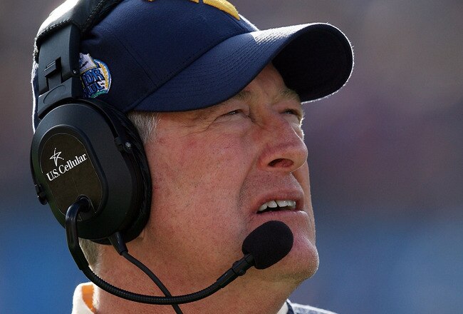 JACKSONVILLE, FL - JANUARY 01:  Head coach Bill Stewart of the West Virginia Mountaineers watches his team take on the Florida State Seminoles during the Konica Minolta Gator Bowl on January 1, 2010 at Jacksonville Municipal Stadium in Jacksonville, Florida. Florida State defeated West Virginia 33-21 in Bobby Bowden's last game as a head coach for the Seminoles.  (Photo by Doug Benc/Getty Images)