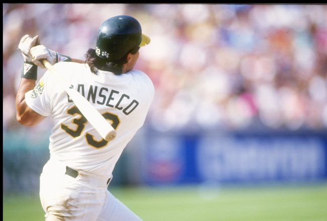 1990:  Outfielder Jose Canseco of the Oakland Athletics swings the bat. Mandatory Credit: Otto Greule  /Allsport