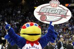 KANSAS CITY, MO - MARCH 13:  The Kansas Jayhawk mascot celebrates with championship banner after the Jayhawks defeated the Kansas State Wildcats to win the 2010 Phillips 66 Big 12 Men's Basketball Championship on March 13, 2010 at the Sprint Center in Kansas City, Missouri.  (Photo by Jamie Squire/Getty Images)