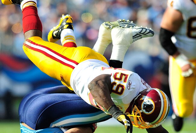 NASHVILLE, TN - NOVEMBER 21:  London Fletcher #59 of the Washington Redskins tackles Chris Johnson #28 of the Tennessee Titans during the first half at LP Field on November 21, 2010 in Nashville, Tennessee.  (Photo by Grant Halverson/Getty Images)