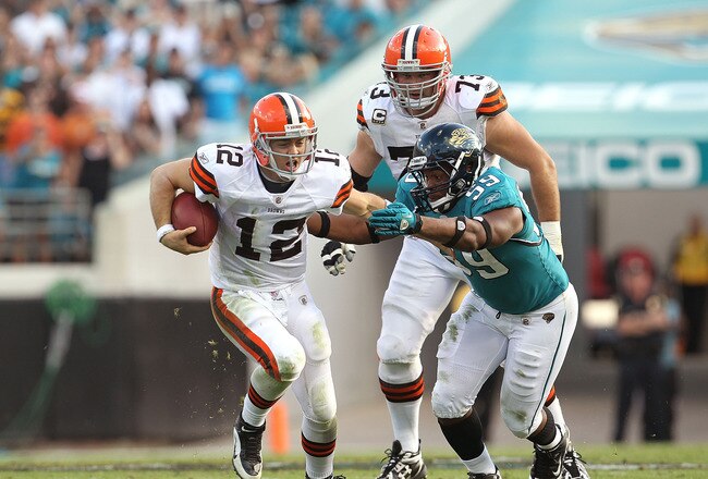 JACKSONVILLE, FL - NOVEMBER 21:  Colt McCoy #12  of the Cleveland Browns is chased down by Larry Hart #59  during a game agaisnt the Jacksonville Jaguars at EverBank Field on November 21, 2010 in Jacksonville, Florida.  (Photo by Mike Ehrmann/Getty Images)