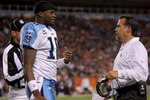 DENVER - NOVEMBER 19:  Quarterback Vince Young #10 calls a time out and confers with head coach Jeff Fisher of the Tennessee Titans during the game against the Denver Broncos at Invesco Field at Mile High November 19, 2007 in Denver, Colorado.  (Photo by Doug Pensinger/Getty Images)