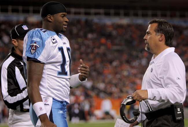 DENVER - NOVEMBER 19:  Quarterback Vince Young #10 calls a time out and confers with head coach Jeff Fisher of the Tennessee Titans during the game against the Denver Broncos at Invesco Field at Mile High November 19, 2007 in Denver, Colorado.  (Photo by Doug Pensinger/Getty Images)